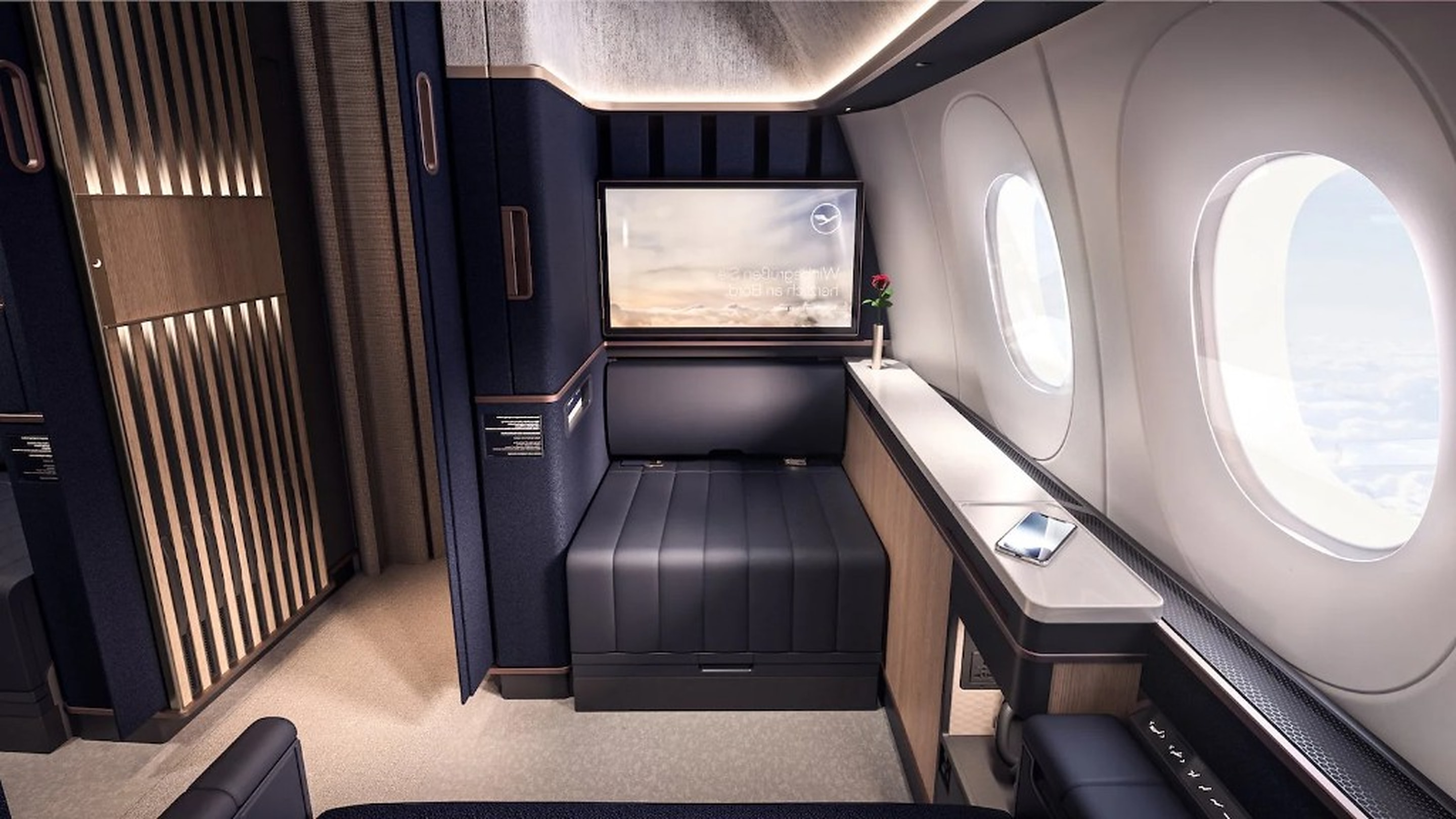 First class suite from the aisle, daylight through the cabin windows